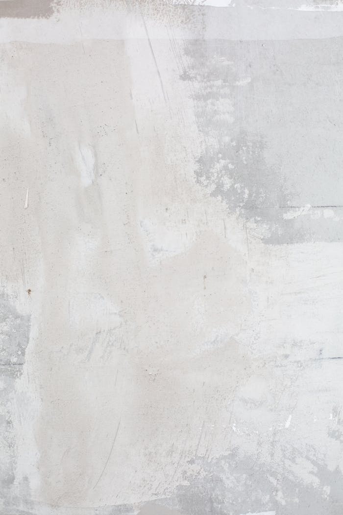 portfolio-01 High-resolution image of an abstract textured wall with white and gray tones, perfect for backgrounds and design projects.